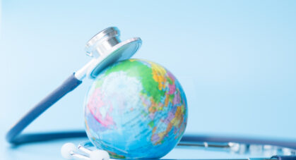 Stethoscope,Wrapped,Around,Globe,On,Blue,Background.,Save,The,Wold,