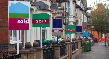 Property,Sales.,Estate,Agents,Sold,Signs,On,Uk,Terraced,Houses