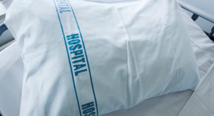 An,Empty,Hospital,Bed,With,The,Word,Hospital,On,A
