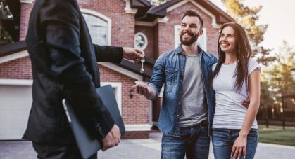 Happy,Couple,Is,Taking,Keys,From,Their,New,House,From