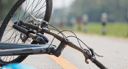 Accident car crash with bicycle on road